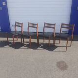 Scandinavian chairs in teak and black skaï.