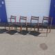 Scandinavian chairs in teak and black skaï.