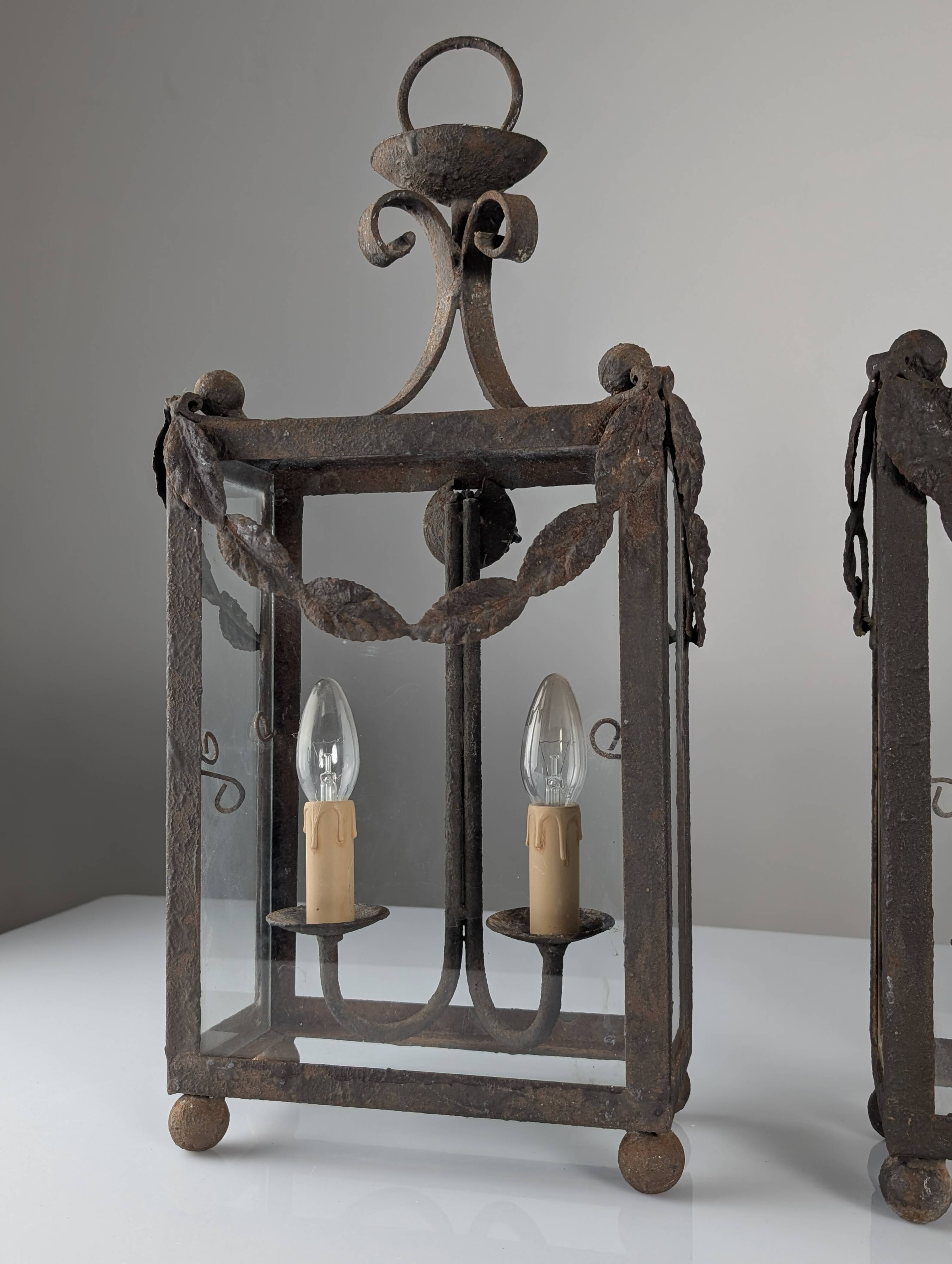 Wrought iron lantern with glass panels, leaf motifs