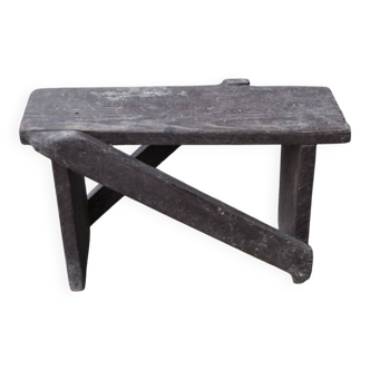 Low stool in vintage brown painted pine from the 1940s, with a rectangular seat.