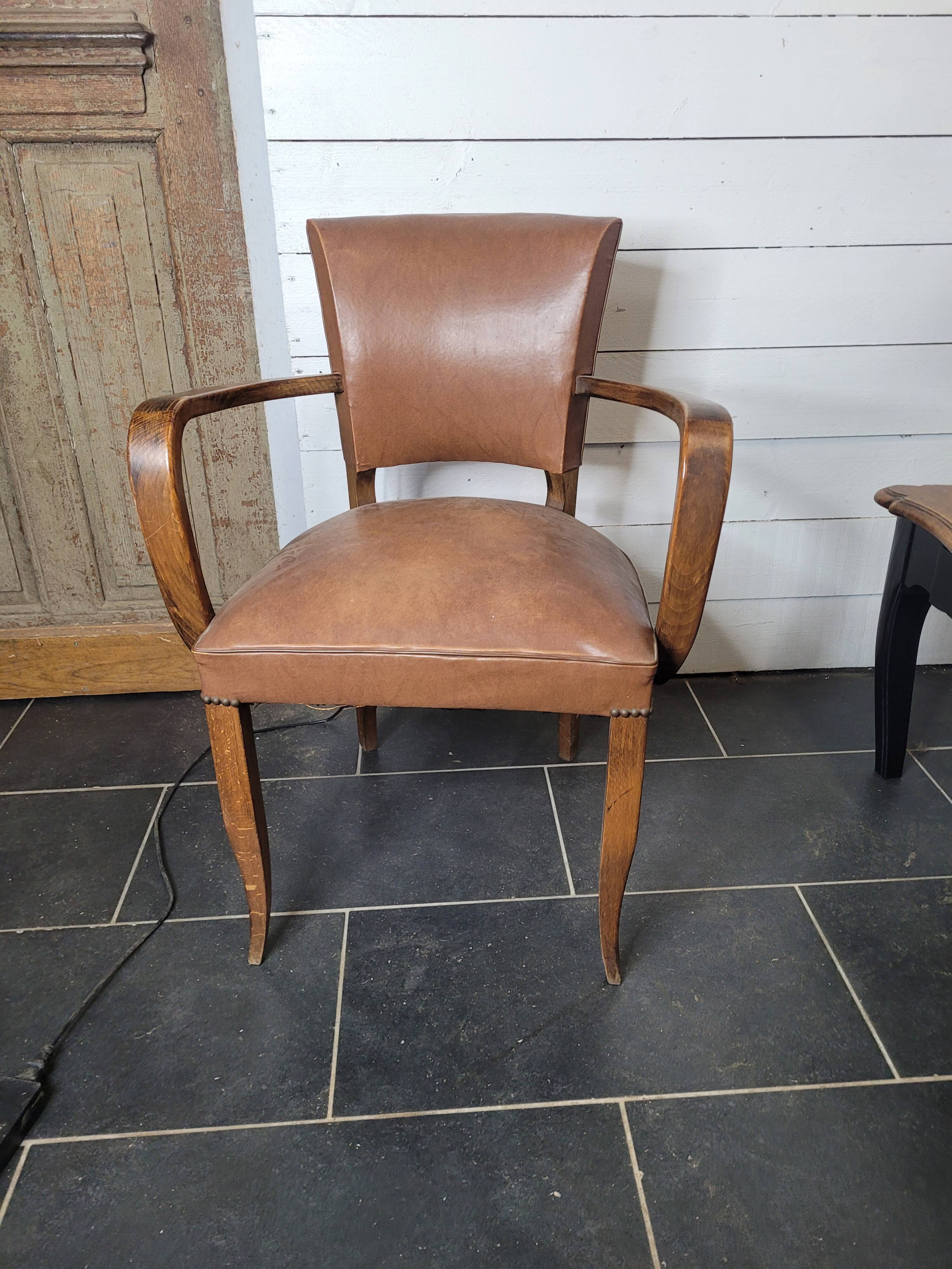 Bridge armchair in skai from the 60s