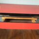 Large table in red formica with extensions + red drawer