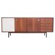 Wooden sideboard with sliding door and white drawers, around 1960.