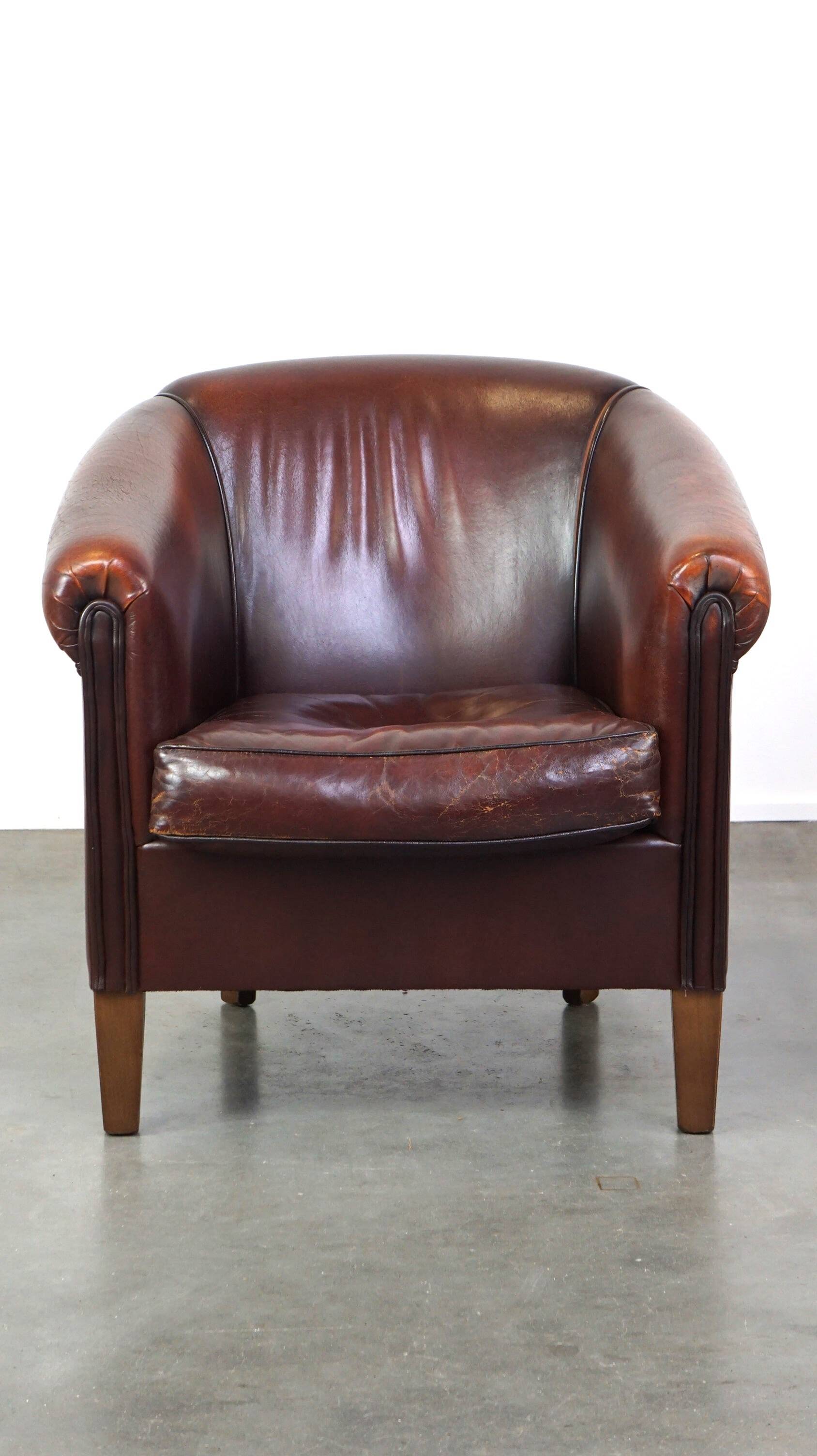Nice sheepskin club chair with a beautiful patina