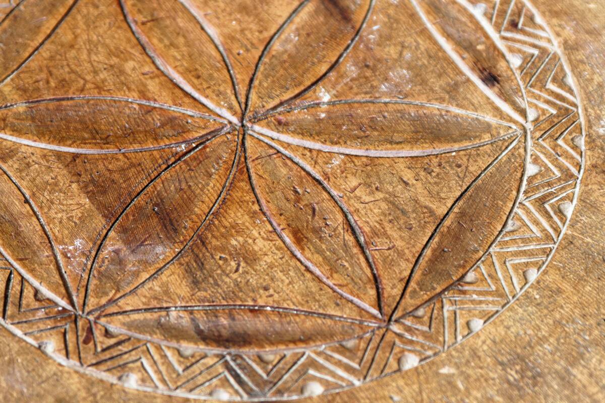 Old Swiss escabelle chair in carved wood