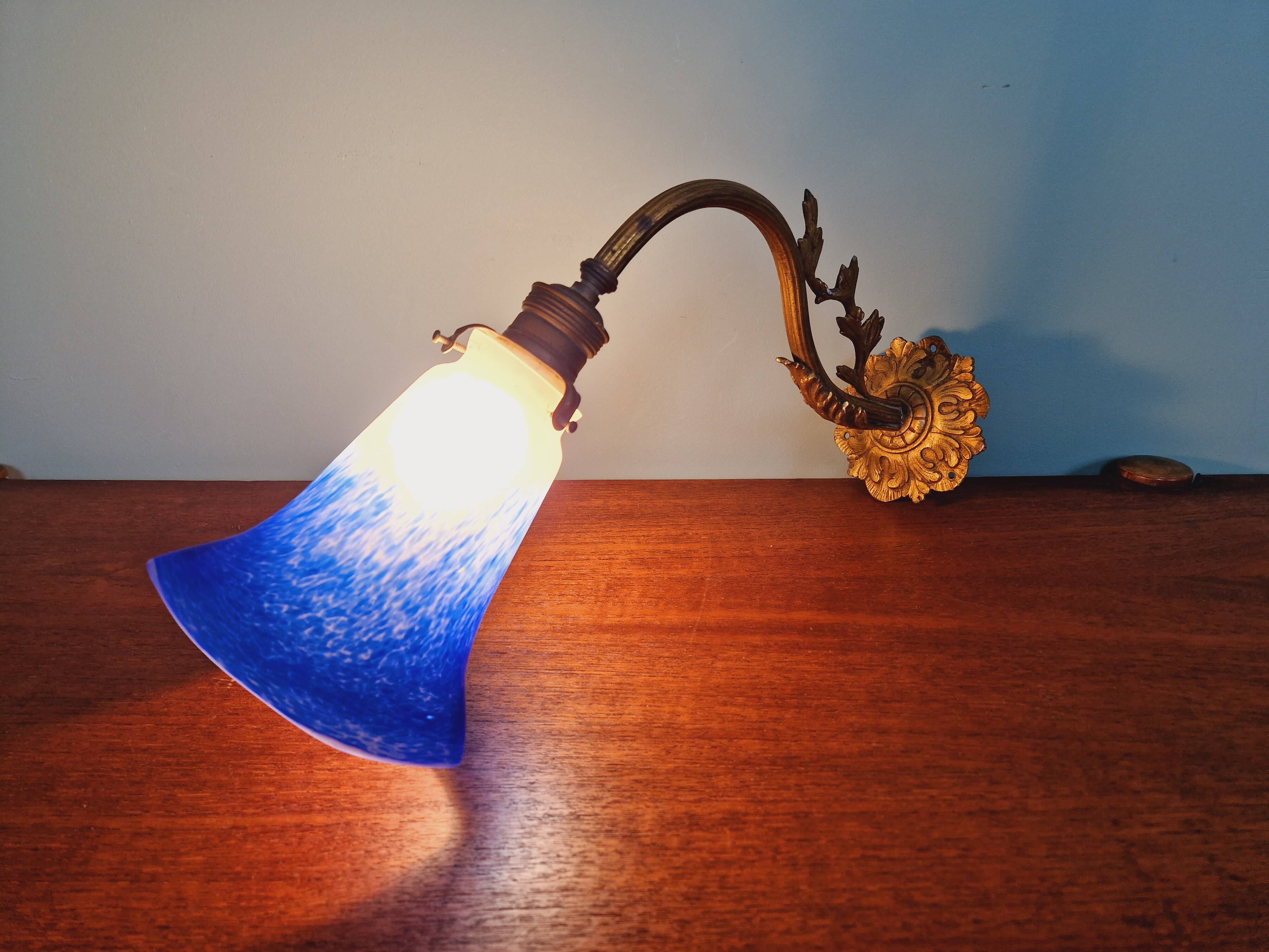 Wall light in gilded bronze and blue marmoreal glass, early 20th century