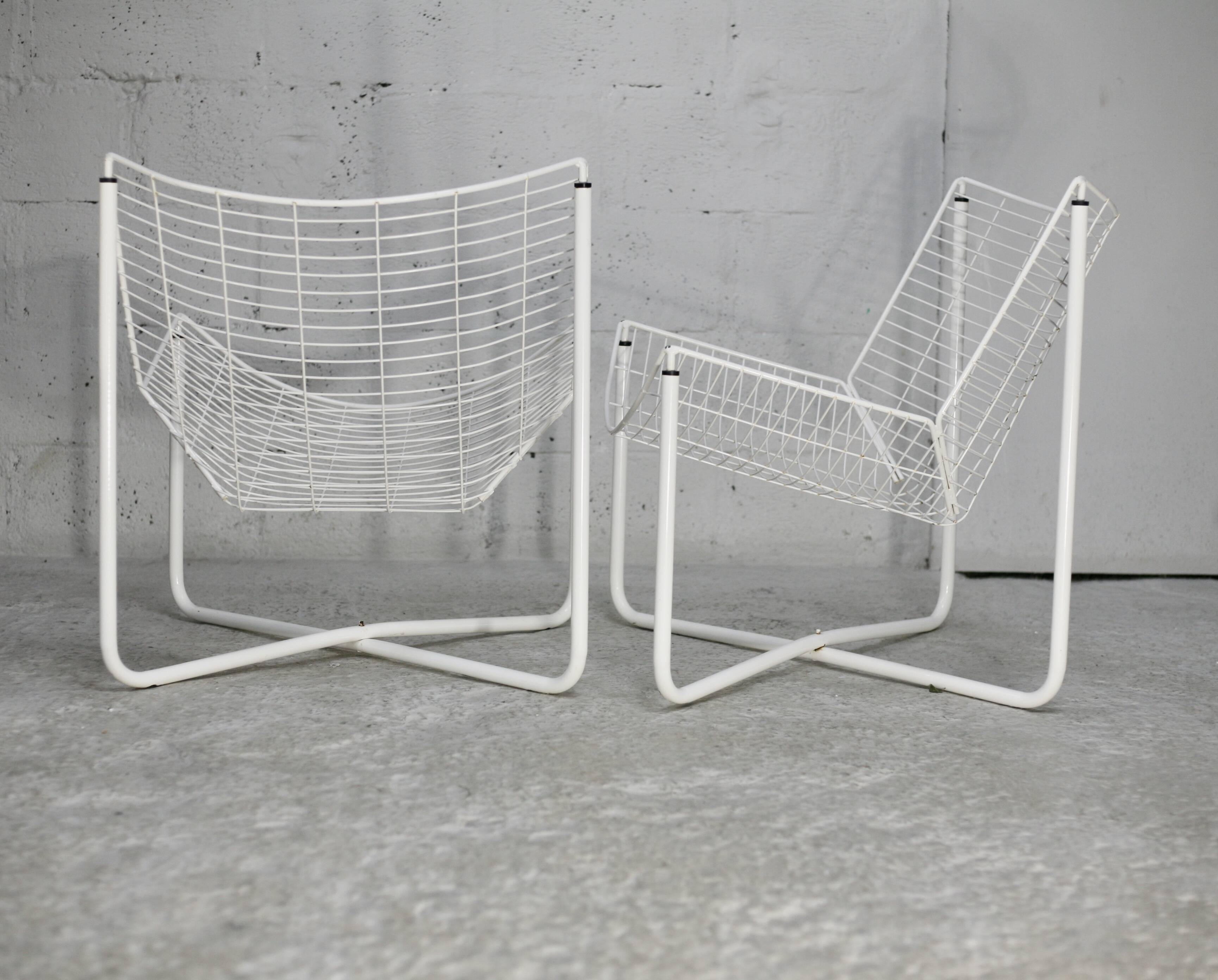Pair of white lacquered steel rod armchairs. Circa 1985