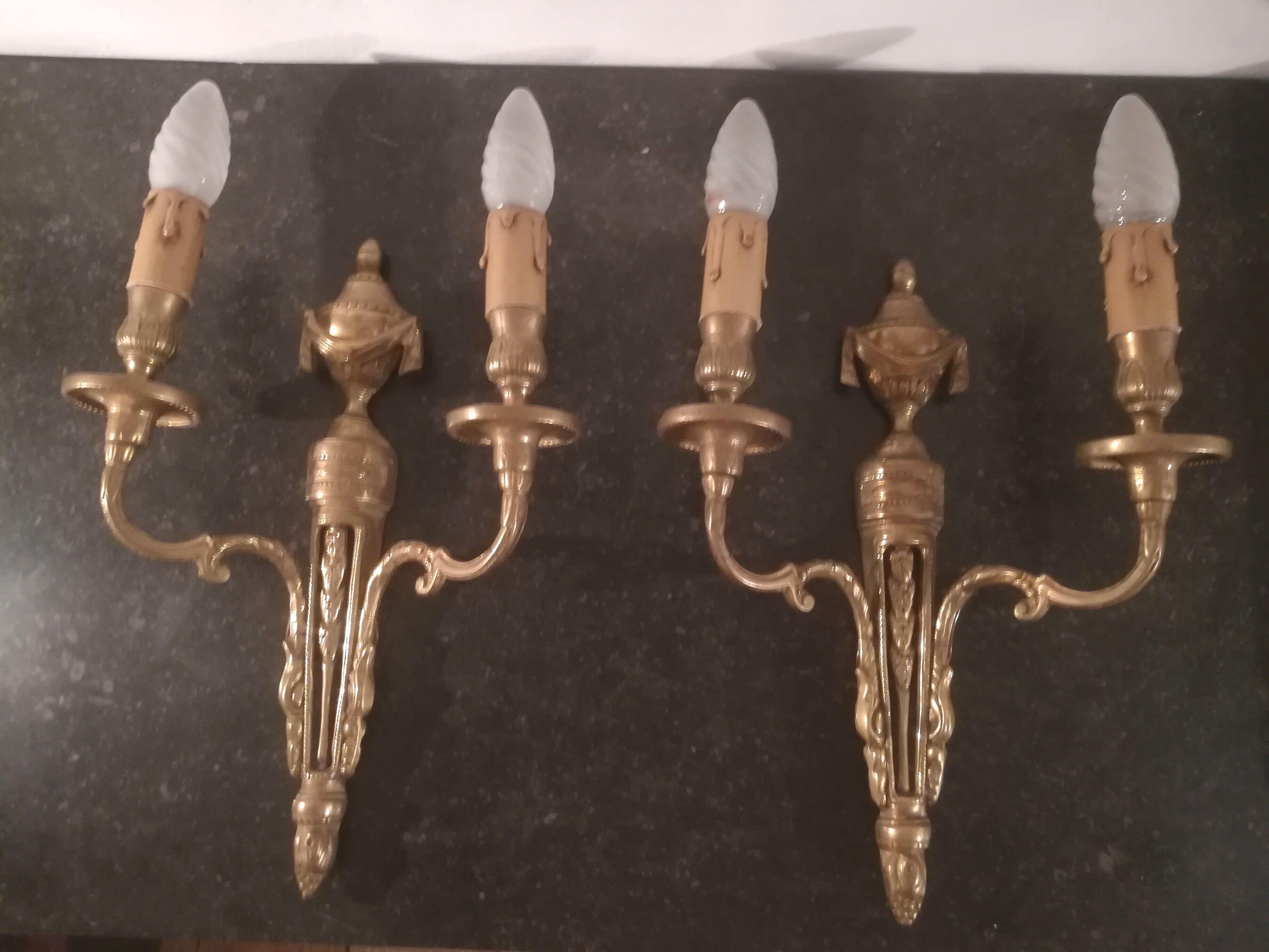 Pair of Louis XVI style sconces in gilded bronze