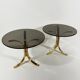 Brass and smoked glass side tables from the 1960s.