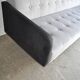 Mid-Century 1960s canapé in grey fabric with black armrests, natural wood base.