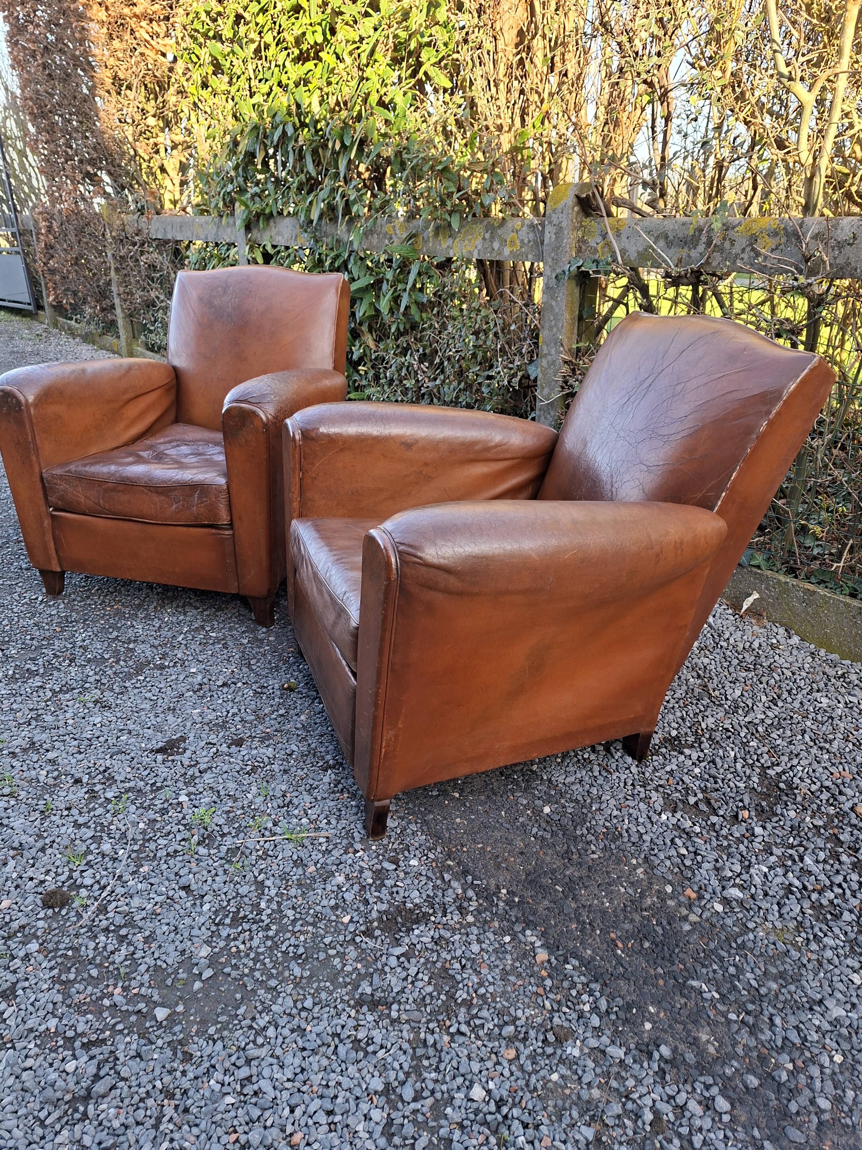 A couple of pairs of genuine restored club armchairs in industrial loft leather.