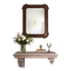 Italian sculpted mirror, patinated brown and gold wood, architectural frame from the 1960s.