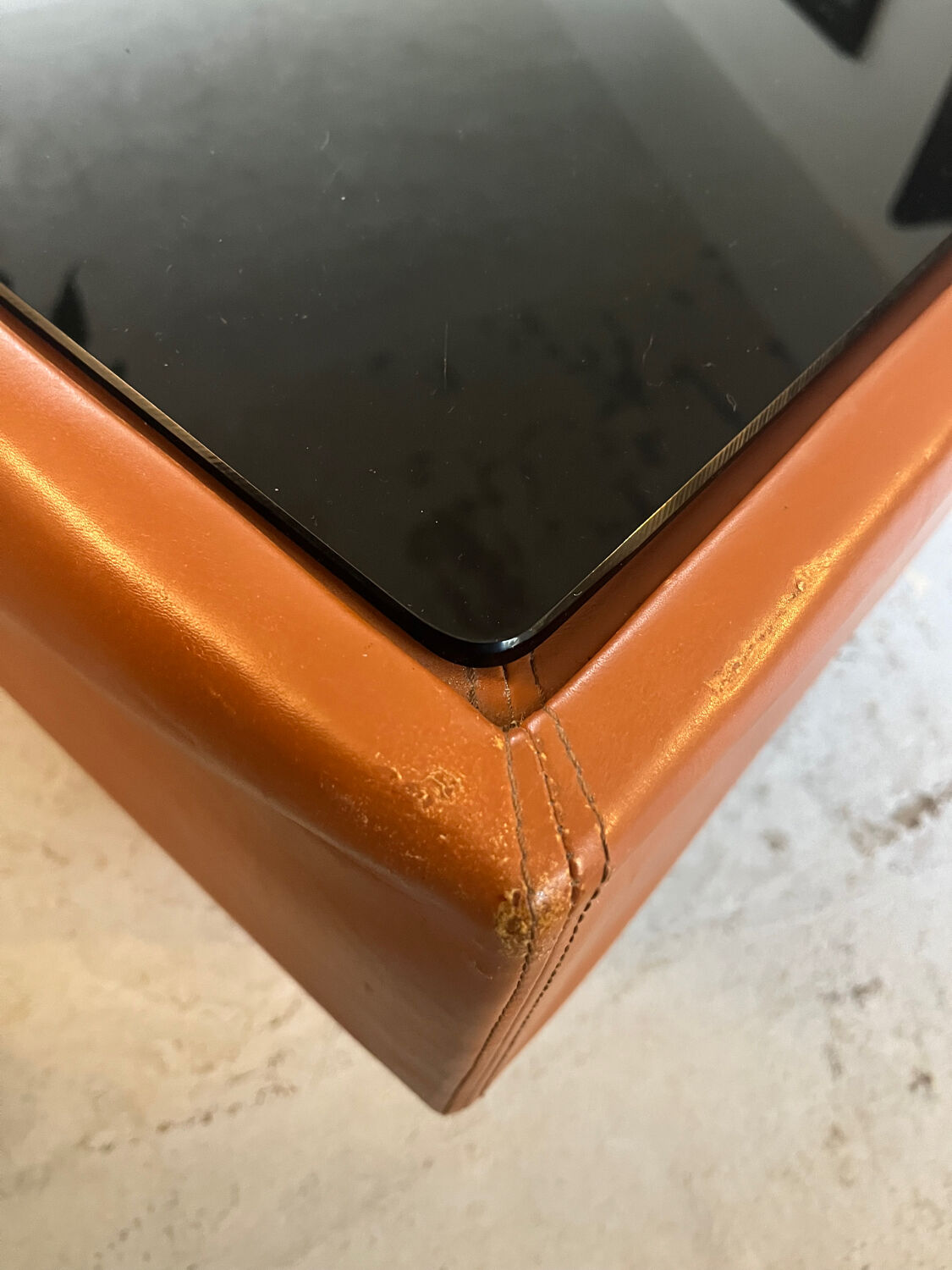 Caramel leather and black glass coffee table