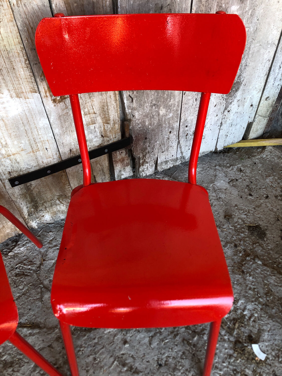 Set of 4 red metal chairs