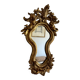 Antique rococo mirror with putti, gilded carved wood and stucco frame, 19th century.