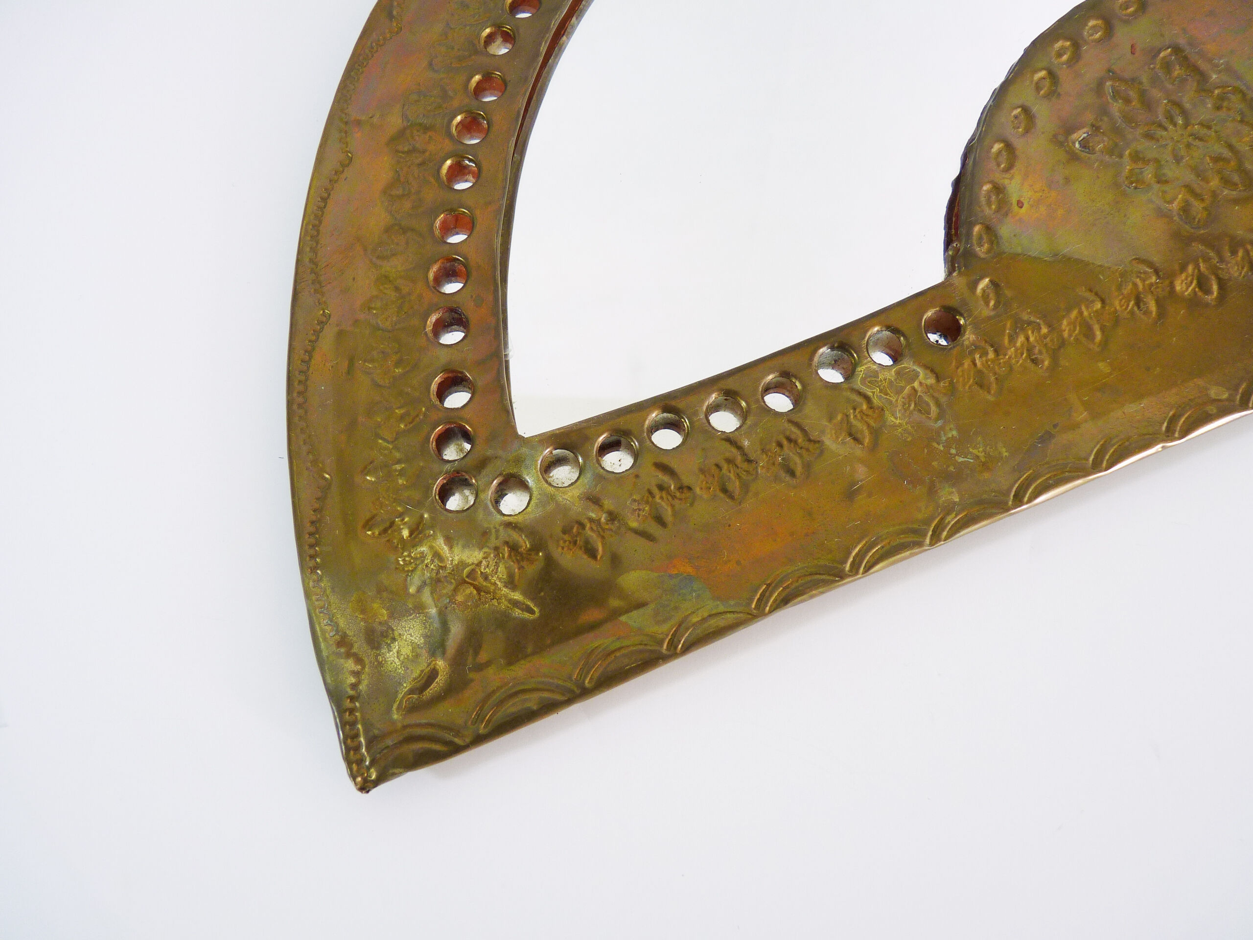 Old wall mirror in the shape of a copper fan pushed back, year 70