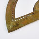 Old wall mirror in the shape of a copper fan pushed back, year 70