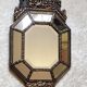 Old octagonal mirror with brass glazing beads