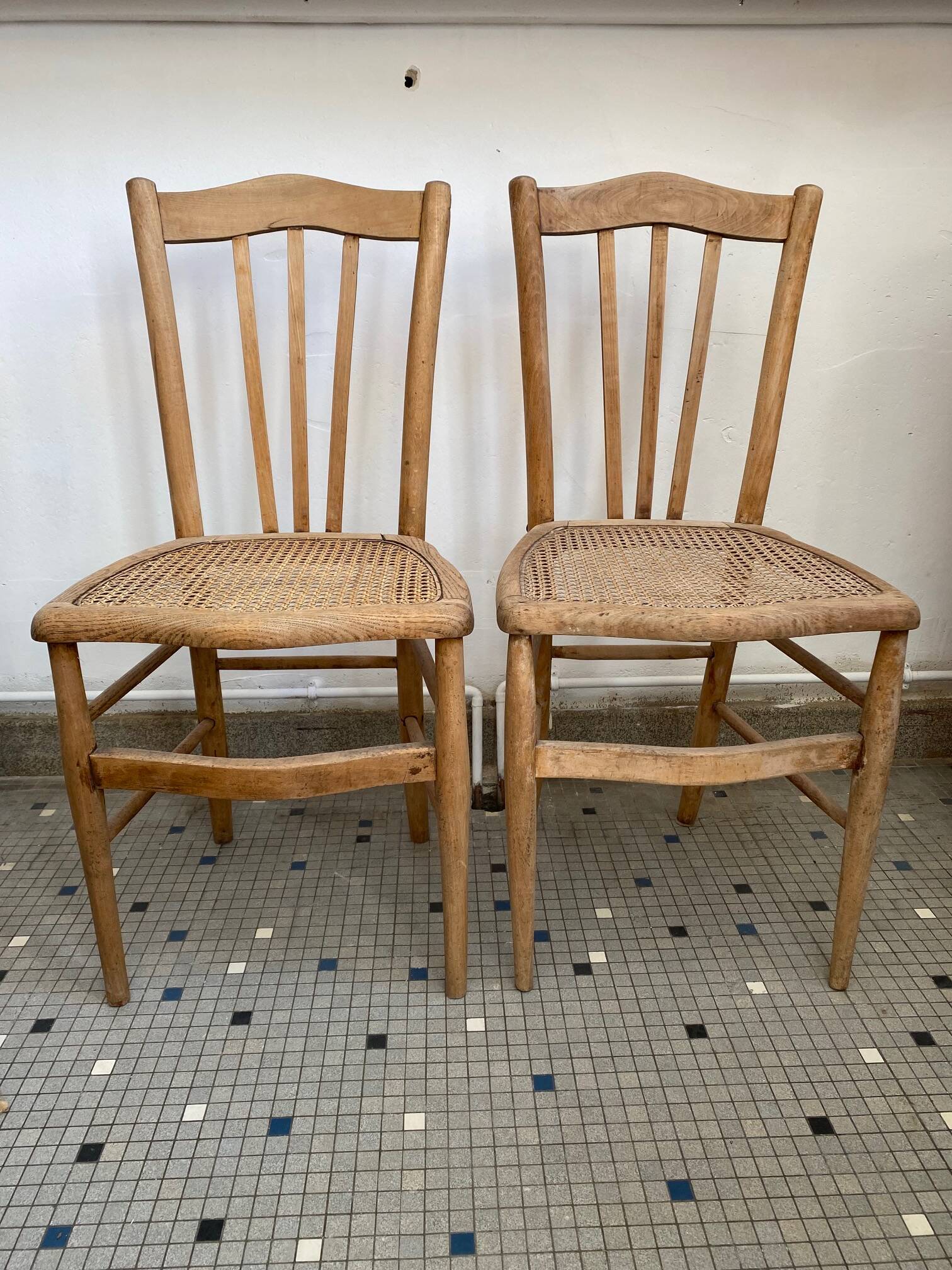 Pair of caned bistro chairs