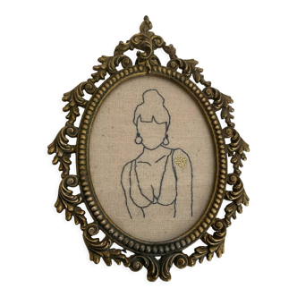 Broderie encadrée