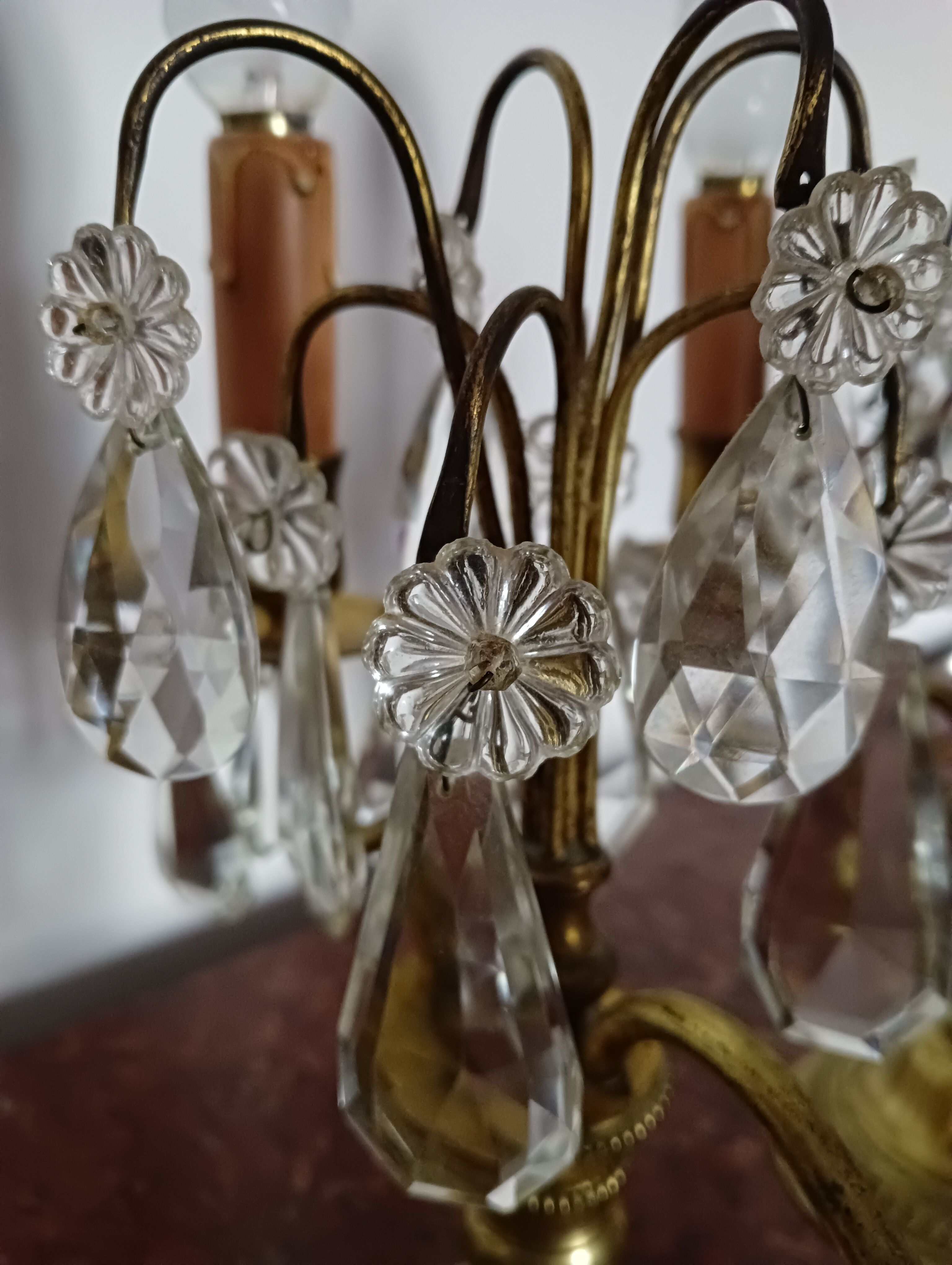 Pair of bronze girandoles with crystal pendants, two arms of lights.