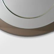 Round brown glass wall mirror attributed to Cristal Art, Italy, 1970s.