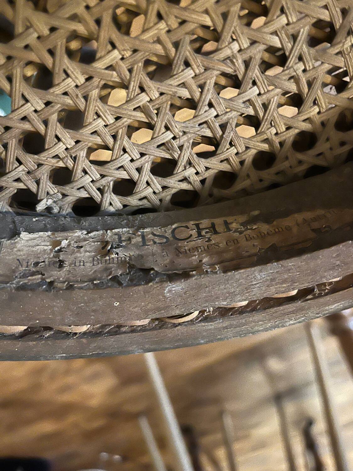 Pair of antique caned bistro chairs stamped Fischel