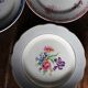 A set of 4 flat plates in pink and blue with Fontanges flowers from Sarreguemines.
