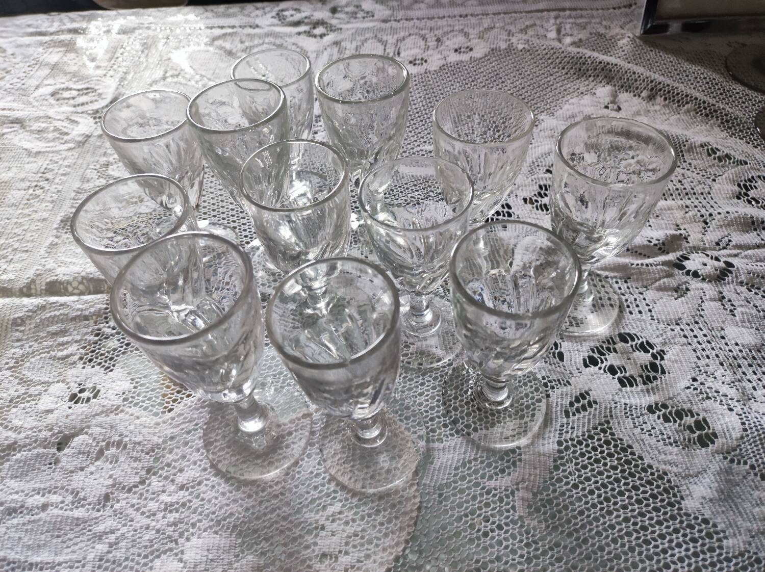 12 small twisted bistro glasses, 19th century