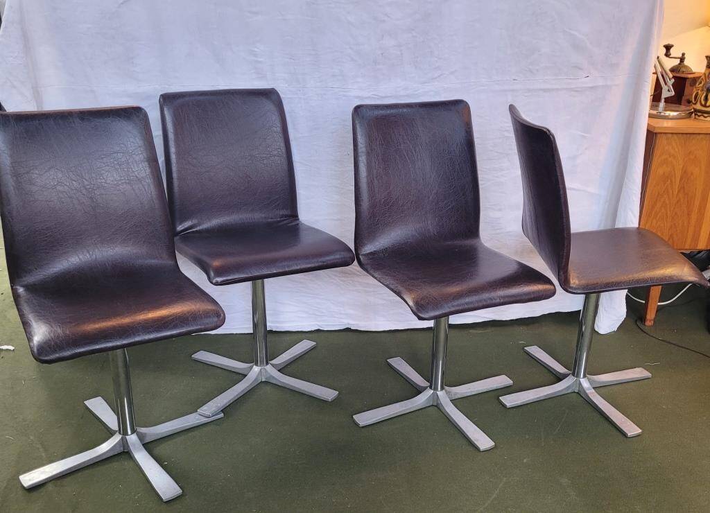 Set of 4 metal and imitation leather swivel chairs.