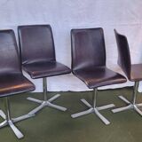 Set of 4 metal and imitation leather swivel chairs.