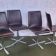 Set of 4 metal and imitation leather swivel chairs.