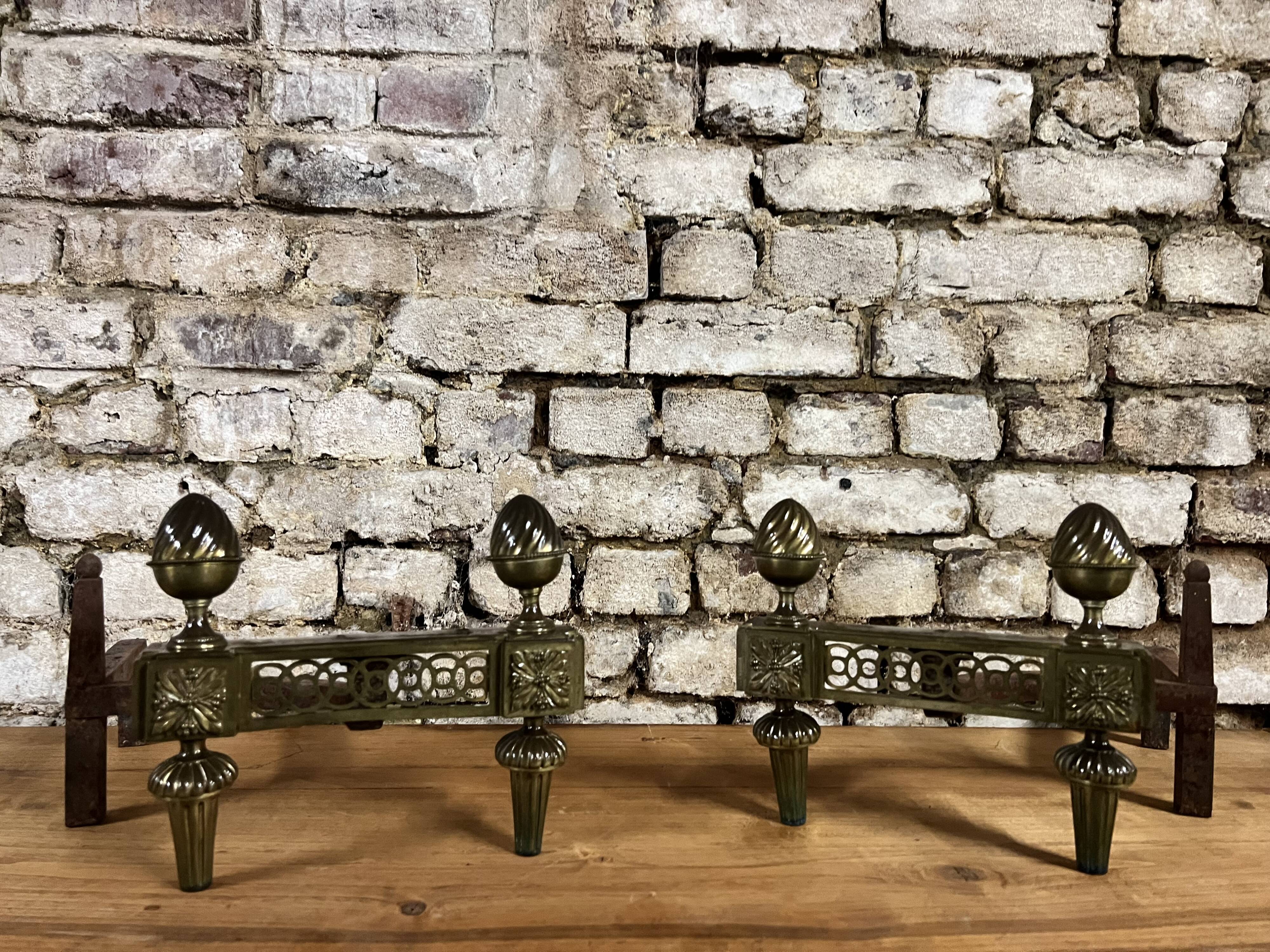 Pair of bronze andirons stamped bouhon frères in louis xvi style