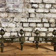 Pair of bronze andirons stamped bouhon frères in louis xvi style