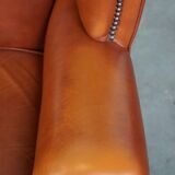 Elegant, smooth, and comfortable English Chesterfield wingback armchair in a beautiful classic color