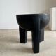 Black mango wood tripod side table with a semi-spherical top, height: 45 cm, diameter: 44 cm.