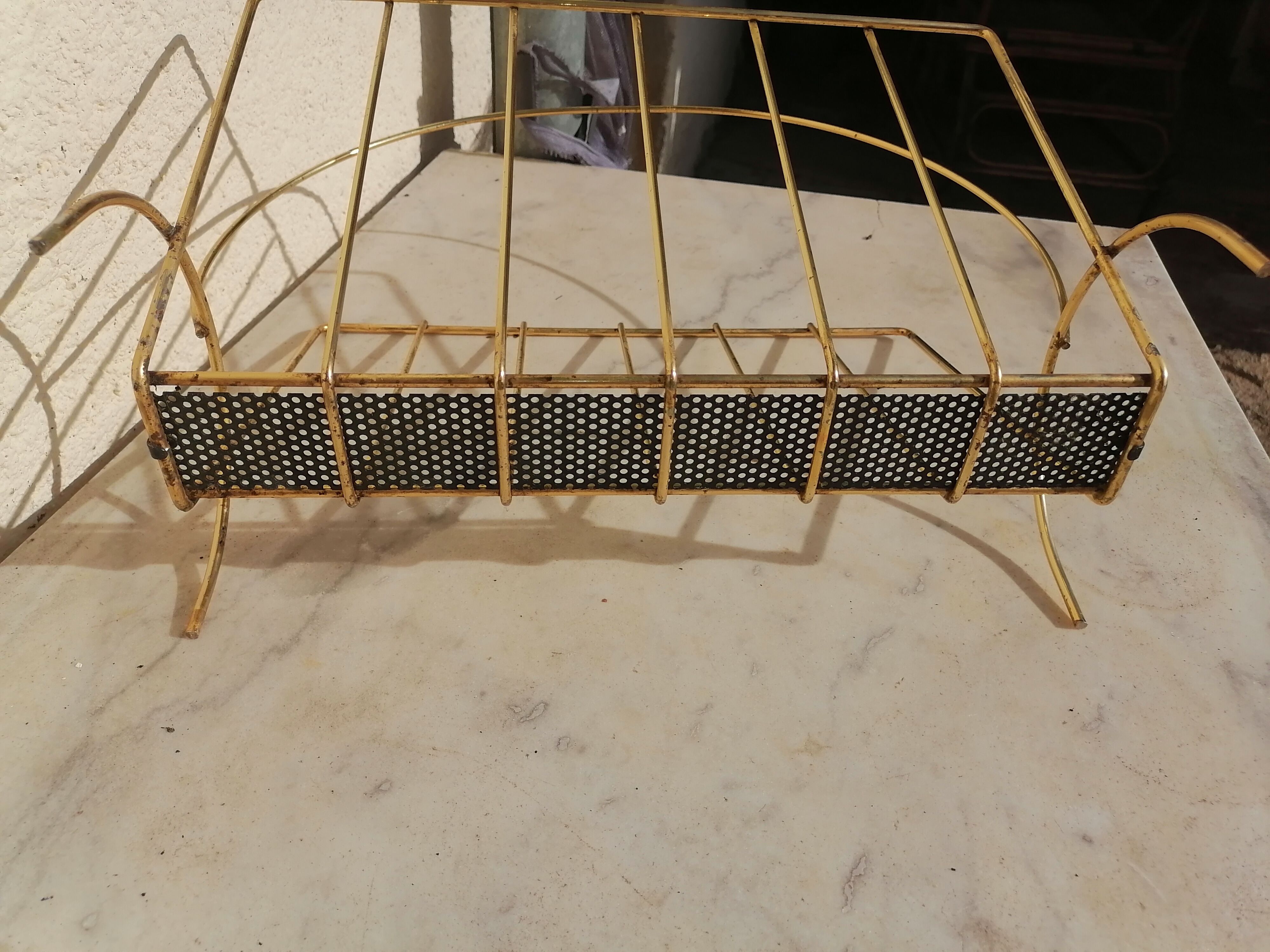 Vintage metal metal perforated magazine holder