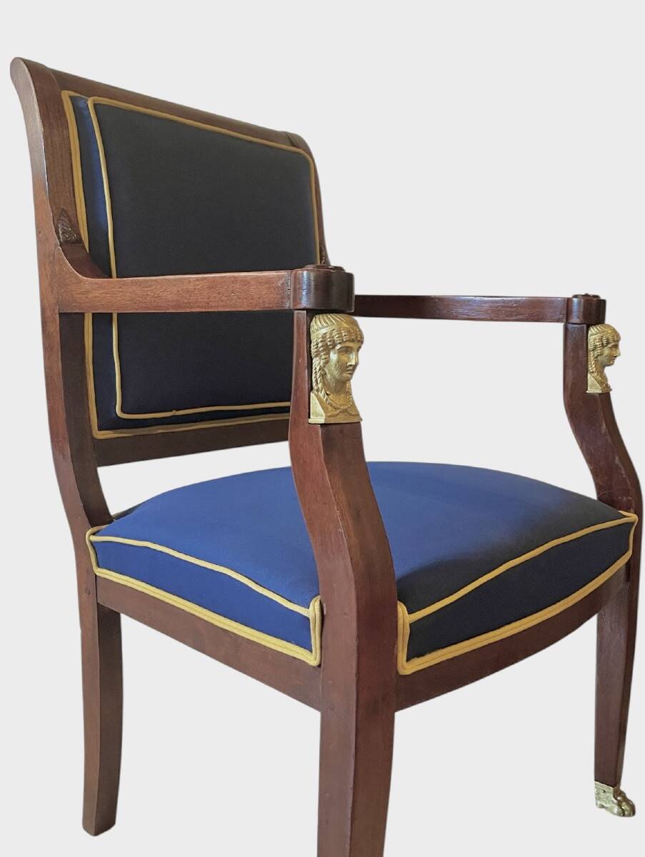 Pair of Empire style armchairs in mahogany and gilt bronze.