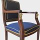 Pair of Empire style armchairs in mahogany and gilt bronze.