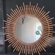 Very large sun mirror in rattan.