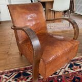 Vintage leather club chair with wooden armrests