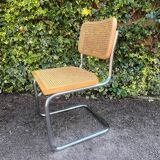 Wooden chair with caning in the style of Marcel Breuer.