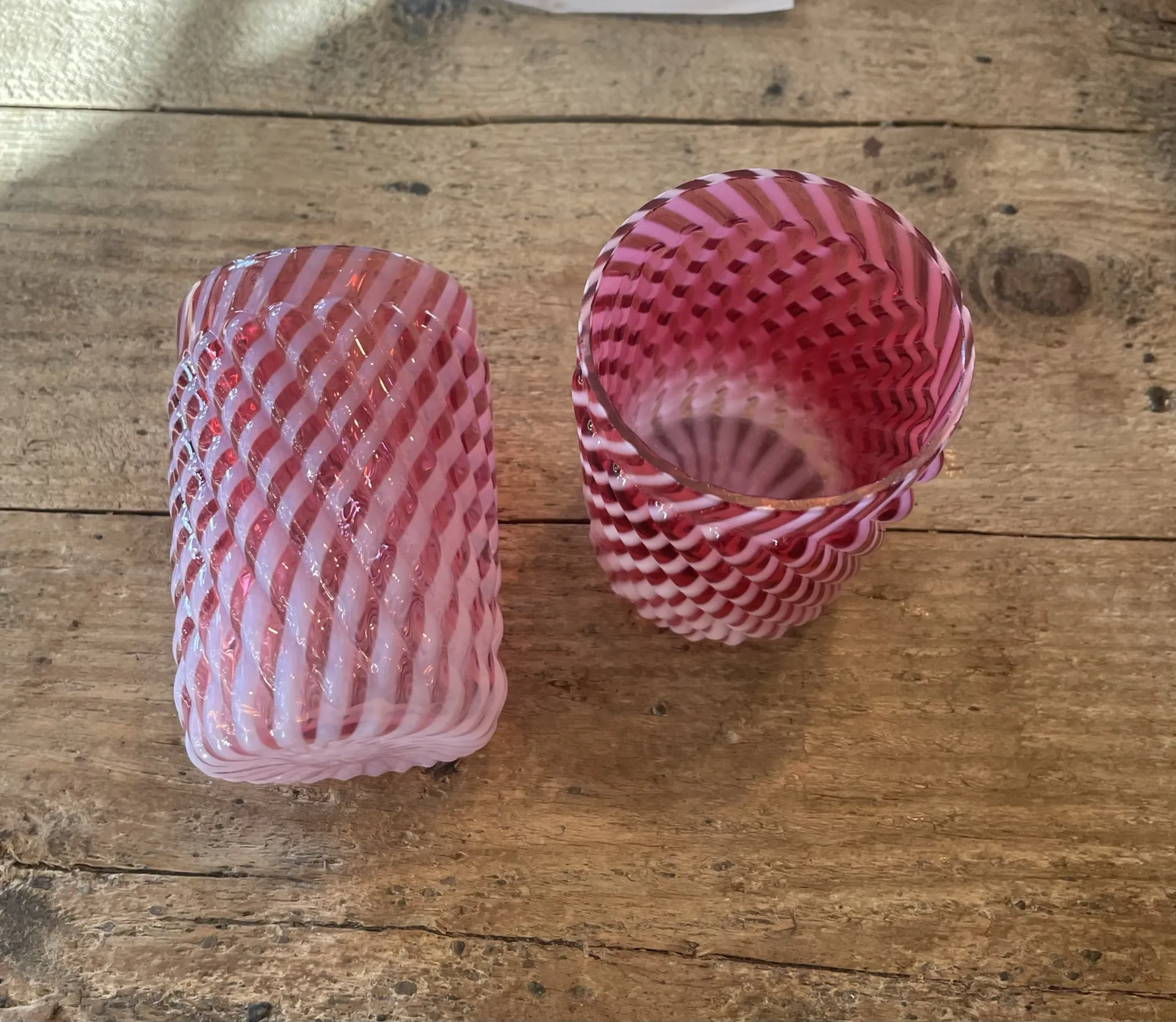 Two Northwood glasses from the 1930s in opalescent pink glass.