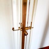 Pair of plexiglass and brass floor lamps