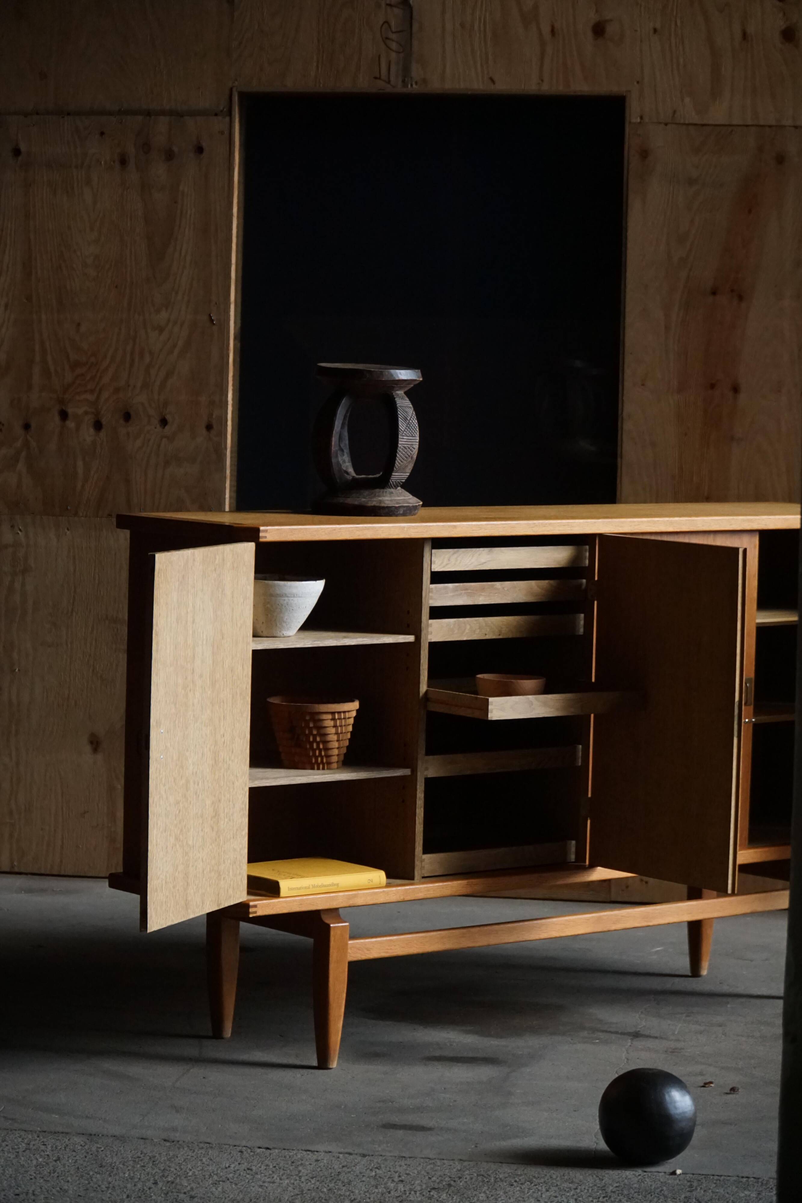 Oak and brass buffet by Henning Kjærnulf, Mid-century modern Danish, 1960s.