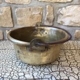 Basin cauldron or old garden in yellow copper