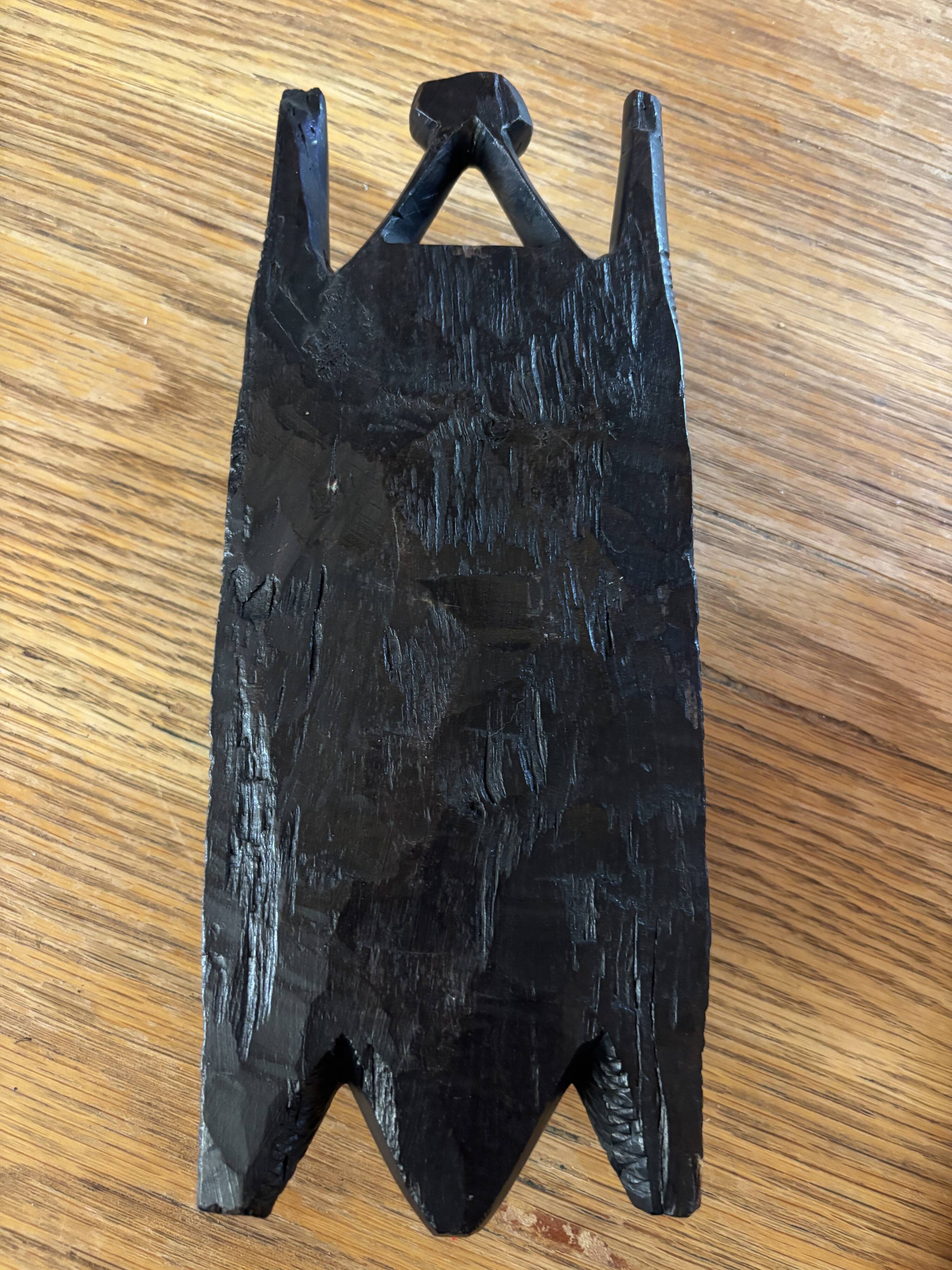 Masque Africain visage souriant en bois d'ébène.