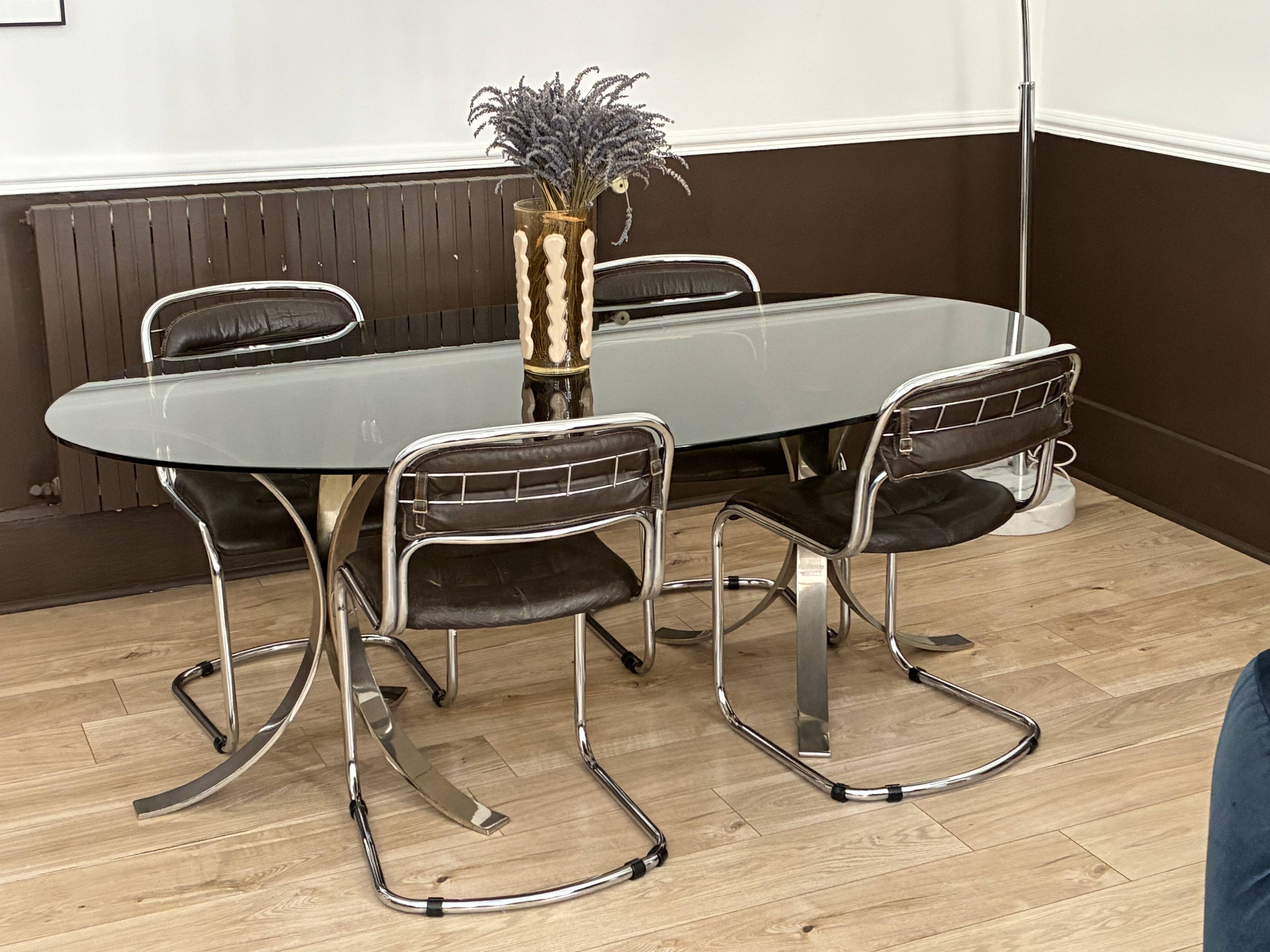 Smoked glass table with a metal base.