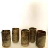 Series of five cups in sandstone