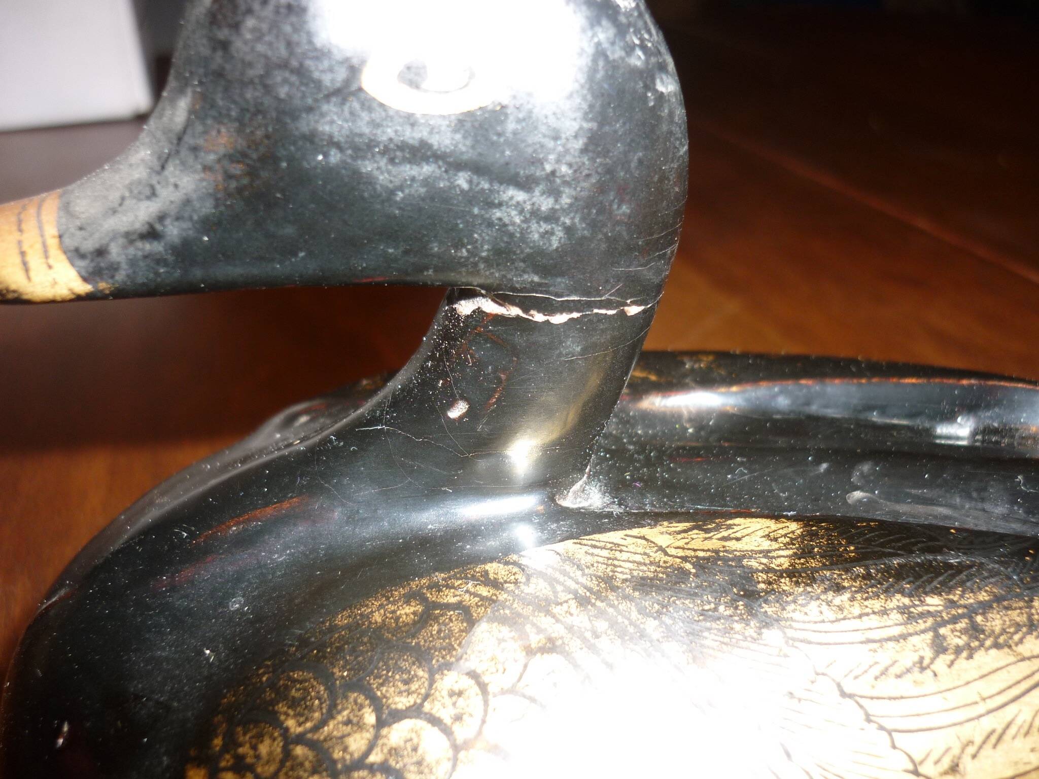 Black and gold wooden duck